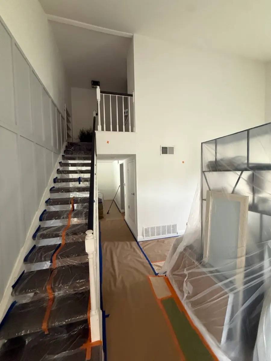 Two storey stairwell fully covered and taped before work